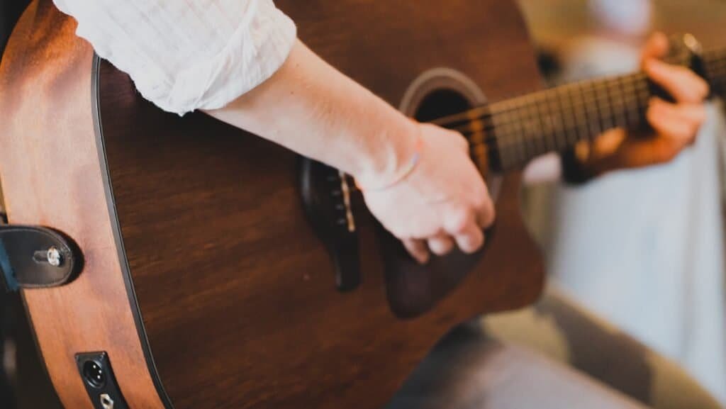 a person playing a guitar