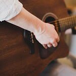 a person playing a guitar